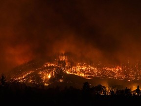 A hillside burns during the Glass Fire in Napa County, Calif., Sept. 27, 2020.