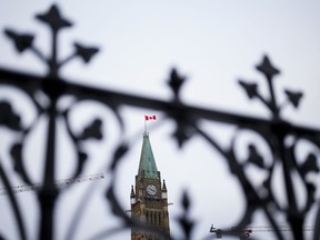 The Peace Tower is pictured on Parliament Hill in Ottawa on Tuesday, Dec. 19, 2023. The federal government recorded a budgetary deficit of $15.1 billion between April and October, $7 billion of which was in October.