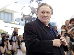Actor Gerard Depardieu poses for photographers during a photo call for the film Valley of Love, at the 68th international film festival, Cannes, southern France, Friday, May 22, 2015.