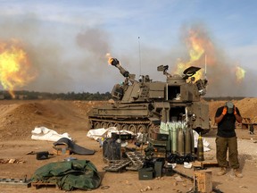 Israeli army self-propelled artillery howitzer fires rounds