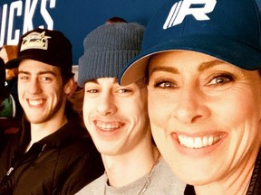 Loni Atwood, with her sons Brandon, 19, centre, and Garrett, 16 at a Canucks game. The 43-year-old from Parksville had chemotherapy treatment delayed after surgery to remove an adrenal gland tumour.