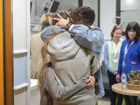 This handout photo provided by GPO on Friday, Dec. 1, 2023, shows Israeli released hostage Mia Shem reuniting with her family at Sheba Medical Center in Tel Hashomer, Ramat Gan, Israel. Mia Shem was released the night of Thursday, Nov. 30, 2023.