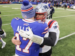 Josh Allen of the Buffalo Bills and Mac Jones of the New England Patriots meet after a game at Highmark Stadium on Dec. 31, 2023 in Orchard Park, New York.