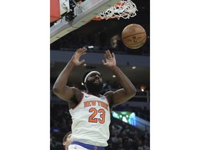 New York Knicks' Mitchell Robinson dunks during the first half of an NBA basketball game Tuesday, Dec. 5, 2023, in Milwaukee.