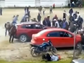 Cartel members fight villagers in central Mexico.
