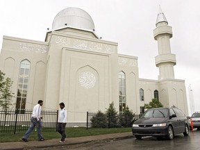 Workmen put the finishing touches on the Baitun Nur mosque, billed as the largest in North America, Wednesday, July 2, 2008.