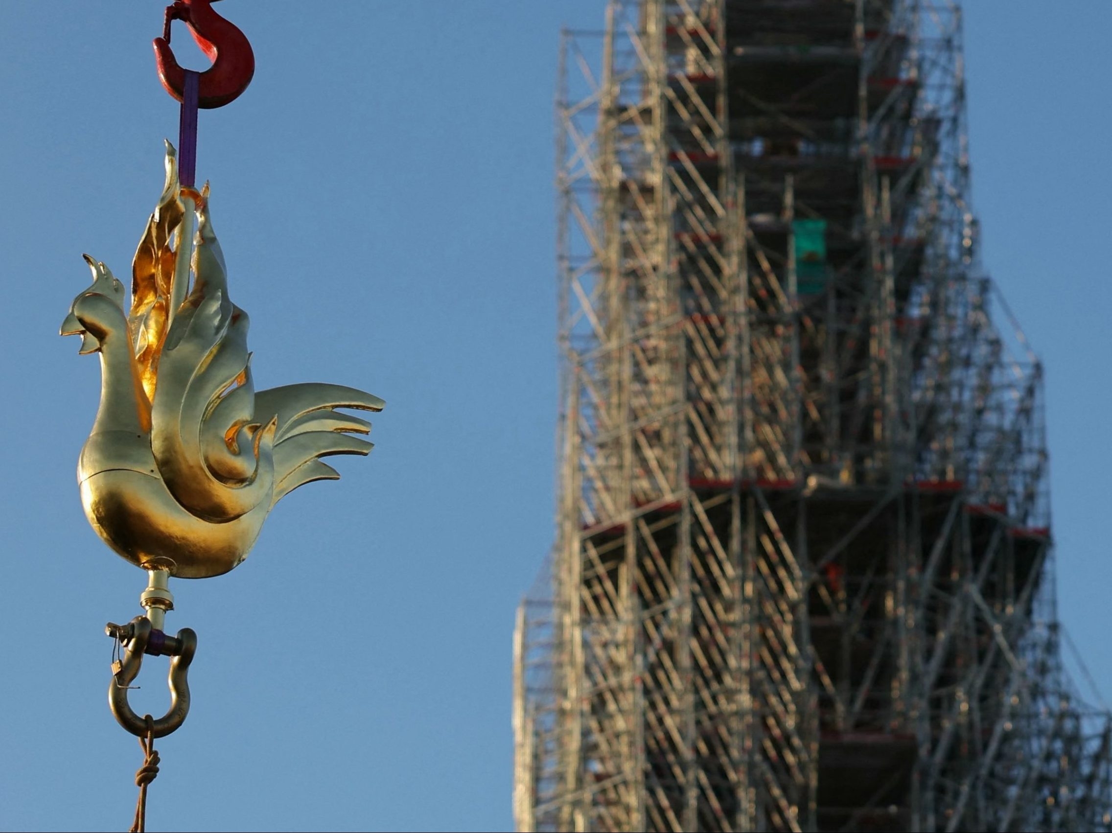 New golden rooster weathervane installed atop Notre Dame Cathedral spire -  CBS News