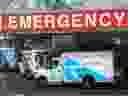A paramedic closes the doors of an ambulance at a hospital in Toronto on Tuesday, April 6, 2021.