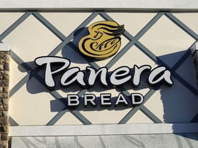 FILE - A Panera Bread logo is attached to the outside of a Panera Bread restaurant location, Dec. 20, 2022, in Westwood, Mass. The family of a 46-year-old Florida man has filed a wrongful death and negligence lawsuit against Panera, claiming its caffeine-filled lemonade drink led to his death.