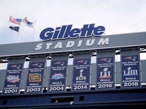FILE - Championship banners hang at Gillette Stadium before an NFL football game in Foxborough, Mass on Sept. 22, 2019. Two Rhode Island men, John Vieira and Justin Mitchell, have been charged with assault and battery and disorderly conduct by police in connection with the death of a fan, Dale Mooney, at a New England Patriots game in September. The review of the available evidence failed to establish a basis for criminal prosecution of charges related to homicide in Mooney's death, Norfolk District Attorney Michael Morrissey said in a statement Thursday, Dec. 21, 2023.