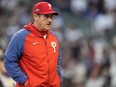 FILE - Philadelphia Phillies Manager Rob Thomson walks to the mound during the fourth inning of Game 1 of a baseball NL Division Series against Atlanta Braves, Oct. 7, 2023, in Atlanta. The Phillies announced Monday, Dec. 4, 2023, that they have extended Thomson's contract through the 2025 season after he led the team to two straight trips to the NL Championship Series.