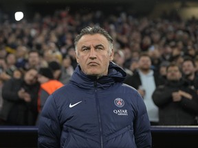 FILE - PSG's head coach Christophe Galtier stands prior to the start of the Champions League round of 16 second leg soccer match between Bayern Munich and Paris Saint Germain at the Allianz Arena in Munich, Germany, on March 8, 2023. Galtier stood trial on Friday Dec. 15, 2023 for accusations of racism during his time as coach of his former club Nice.