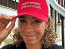 Sage Steele wearing red baseball cap with