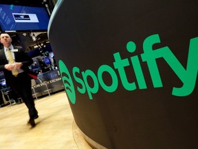 A trading post sports the Spotify logo on the floor of the New York Stock Exchange, Tuesday, April 3, 2018.