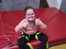 Stella Leblanc-Beaudoin, 7, is triumphant after her rock wall climb at Variety Village in Scarborough.