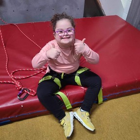 Stella Leblanc-Beaudoin, 7, is triumphant after her rock wall climb at Variety Village in Scarborough.