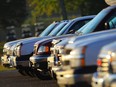 Vehicles photographed in a car lot.