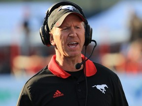 Calgary Stampeders head coach Dave Dickinson yells instructions during CFL action against the Ottawa Redblacks at McMahon Stadium in Calgary on Thursday June 29, 2017.