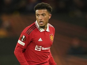 Manchester United's Jadon Sancho controls the ball during a match.