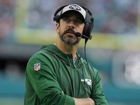 New York Jets quarterback Aaron Rodgers looks up during the second half of an NFL football game against the Miami Dolphins.