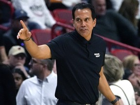 Miami Heat coach Erik Spoelstra gestures during the first half of the team's NBA basketball game against the Atlanta Hawks.