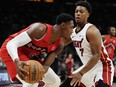 Toronto Raptors guard RJ Barrett (9) protects the ball from Miami Heat guard Kyle Lowry.