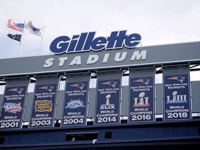 Championship banners hang at Gillette Stadium before an NFL football game in Foxborough, Mass on Sept. 22, 2019. ne of two Rhode Island men charged with assault and battery and disorderly conduct in connection with the death of a fan at a New England Patriots game pleaded not guilty Friday, Jan. 19, 2024.