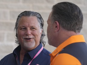 Michael Andretti, left, speaks as McLaren CEO Zak Brown listens in the paddock ahead of the Formula One U.S. Grand Prix.