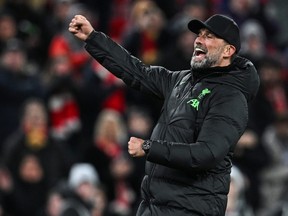 Liverpool manager Jurgen Klopp celebrates at the end of the English Premier League football match between Liverpool and Chelsea.