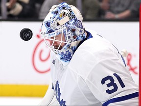 Maple Leafs goaltender Martin Jones takes a shot on goal off his mask during the second period against the Anaheim Ducks at Honda Center on Jan. 3, 2024 in Anaheim.