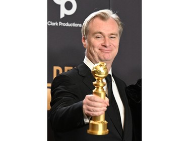 Christopher Nolan poses in the press room with the award for Best Director - Motion Picture for "Oppenheimer" during the 81st annual Golden Globe Awards at The Beverly Hilton hotel in Beverly Hills, Calif., on Jan. 7, 2024.