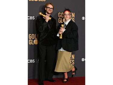 Billie Eilish and Finneas O'Connell pose with the award for Best Original Song - Motion Picture "What Was I Made For" from the movie "Barbie" in the press room during the 81st annual Golden Globe Awards at The Beverly Hilton hotel in Beverly Hills, Calif., on Jan. 7, 2024.