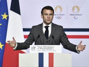 French President Emmanuel Macron delivers a speech to present his New Year's wishes to elite athletes ahead of the Paris 2024 Olympic and Paralympic Games, at France's National Institute of Sport, Expertise, and Performance (INSEP) in Paris, on January 23, 2024. (Photo by STEPHANE DE SAKUTIN/POOL/AFP via Getty Images)