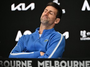 Serbia's Novak Djokovic attends a press conference after losing against Italy's Jannik Sinner in their men's singles semi-final match on day 13 of the Australian Open tennis tournament in Melbourne on January 26, 2024. (Photo by SAEED KHAN/AFP via Getty Images)