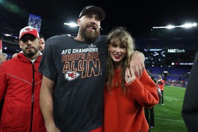 Travis Kelce of the Kansas City Chiefs celebrates with Taylor Swift after a 17-10 victory against the Baltimore Ravens in the AFC Championship Game at M&T Bank Stadium on Jan. 28, 2024 in Baltimore, Md