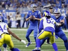 Detroit Lions quarterback Jared Goff throws during the first half of an NFL wild-card playoff football game against the Los Angeles Rams, Sunday, Jan. 14, 2024, in Detroit. (AP Photo/Duane Burleson)