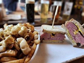 Poutine and a smoked meat sandwich at Le Saint-Pub in Baie-Saint-Paul. What’s not to like? SARA SHANTZ PHOTO