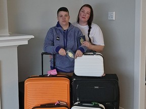 Meagan Watson, left, and her wife Mindy are seen in a undated handout photo with their luggage.