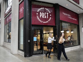 People leave the Pret A Manger store front in Toronto, Tuesday, Jan. 23, 2024.