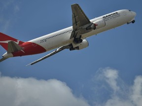 A Qantas plane takes off.
