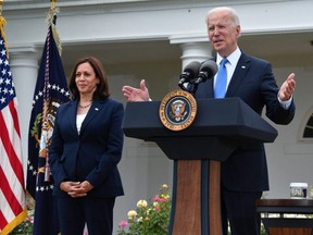 U.S. Vice President Kamala Harris looks on as U.S. President Joe Biden delivers remarks from the Rose Garden of the White House in Washington, D.C., May 13, 2021.