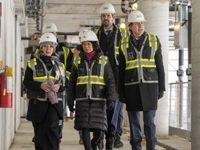 Prime Minister Justin Trudeau, right, tours a housing development with Toronto Mayor Olivia Chow, centre, Parliamentary Secretary to the Minister of Environment and Climate Change Julie Dabrusin, left, and Housing Minister Sean Fraser, second from right, in Toronto, Thursday, Dec. 21, 2023. THE CANADIAN PRESS/Frank Gunn