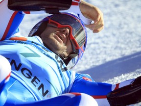 France's Alexis Pinturault lies on the snow after crashing during an alpine ski, men's World Cup super-G race, in Wengen, Switzerland, Friday, Jan. 12, 2024.