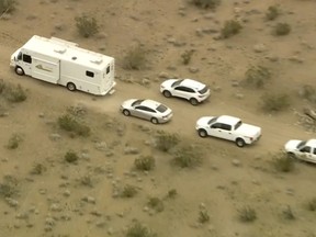 This aerial still image from video provided by KTLA shows law enforcement vehicles where several people were found shot to death in El Mirage, Calif. on Wednesday, Jan. 24, 2024.