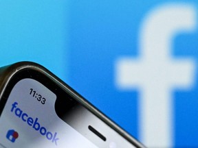 A photo taken on Nov. 17, 2023, shows the Facebook logo on a smartphone screen in Frankfurt, Germany.