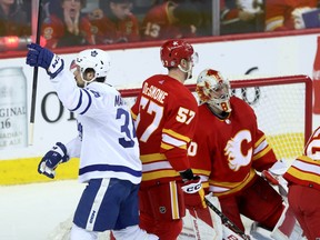 Calgary Flames goalie Dan Vladar is scored on by Toronto Maple Leafs Auston Matthews with the hat trick in second period NHL action at the Scotiabank Saddledome in Calgary on Thursday, January 18, 2024. Darren Makowichuk/Postmedia