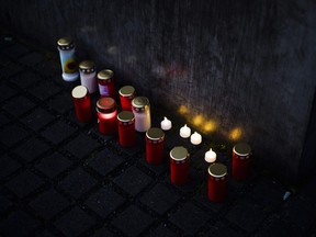 Candles placed at the Holocaust Memorial at the eve of the International Holocaust Remembrance Day in Berlin, Germany, Friday, Jan. 26, 2024.