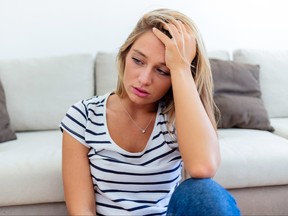 Depressed upset young woman feeling hurt sad stressed troubled with unwanted pregnancy, regret mistake abortion, having headache or drug addiction, suffer from grief dramatic bad problem concept.