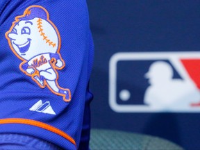 The New York Mets logo is seen on the sleeve of a player on Oct. 26, 2015.
