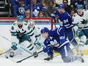 Toronto Maple Leafs forward Mitchell Marner (16) shoots on San Jose Sharks goaltender Kaapo Kahkonen (36) as defenceman Mario Ferraro (38) defends during first period NHL hockey action in Toronto on Tuesday, Jan. 9, 2024.